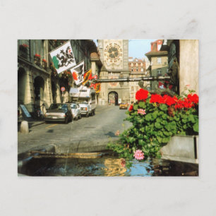 Berne, Main street,clocktower and geraniums Postcard