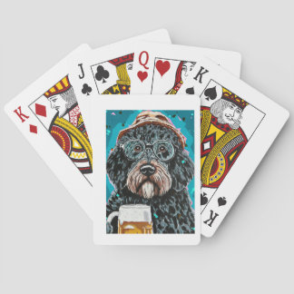 Bernedoodle holding a beer mug playing cards