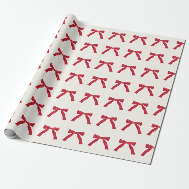 berry red ribbon bows on cream christmas holiday wrapping paper (Unrolled)