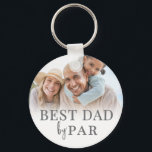 Best Dad By Par Photo Key Ring<br><div class="desc">This personalized keychain for a golf loving dad features a clean and classic design with a soft white gradient background. The phrase Best Dad By Par is displayed at the top in a timeless serif font, giving it a heartfelt and meaningful touch. At the bottom, there’s space for a custom...</div>