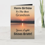 Best Grandson Light Shines Bright Birthday Card<br><div class="desc">Express your wishes to your grandson for a happy day on an inspirational sunset birthday card with the verse “Your Light Shines Bright”. The minimal design is modern with bold colours of gold and black showing glowing water and a peaceful lake.</div>