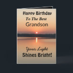 Best Grandson Light Shines Bright Birthday Card<br><div class="desc">Express your wishes to your grandson for a happy day on an inspirational sunset birthday card with the verse “Your Light Shines Bright”. The minimal design is modern with bold colours of gold and black showing glowing water and a peaceful lake.</div>