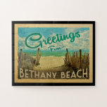 Bethany Beach Vintage Travel Jigsaw Puzzle<br><div class="desc">This Greetings From Bethany Beach vintage postcard design features a sandy beach with a beautiful turquoise ocean water and above the sea,  a blue sky with billowy white clouds. In vintage travels style.</div>