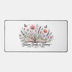 Between books and blooms book lover reader desk mat