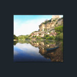 Beynac-et-Cazenac and Dordogne river canvas print<br><div class="desc">Canvas landscape print of the castle and the village of Beynac-et-Cazenac built upon the cliffs alongside Dordogne river in the early morning with reflection in the river and a kayak in the foreground. The town is situated in the Perigord in France.</div>