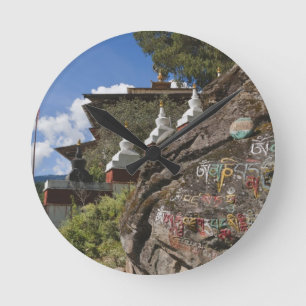 Bhutanese writing on rocks and Nepalese chortens Round Clock