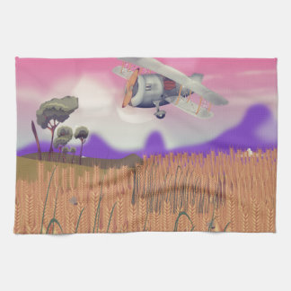 Bi-Plane Flying over crops under setting sun Tea Towel