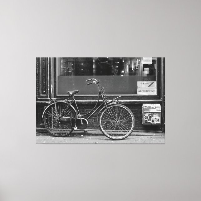Bicycle in fornt of shop window canvas print (Front)