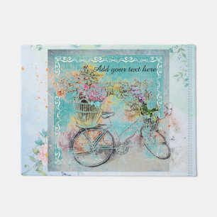 Bicycle with flower baskets on blue burlap doormat