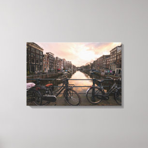 Bicycles at sunset in Amsterdam Canvas Print