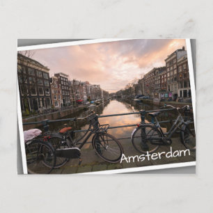 Bicycles at sunset in Amsterdam Postcard
