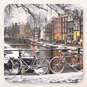 Bicycles in the snow in Amsterdam Square Paper Coaster