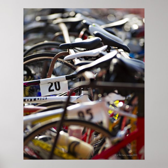 Bicycles on the rack at a triathlon race ready poster (Front)