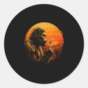 Bigfoot blowing dandelion retro sunset forest classic round sticker