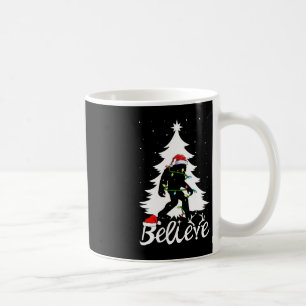 Bigfoot Carrying Christmas Tree Sasquatch Believer Coffee Mug