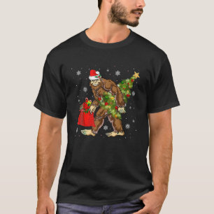 Bigfoot Carrying Christmas Tree Sasquatch Believer T-Shirt