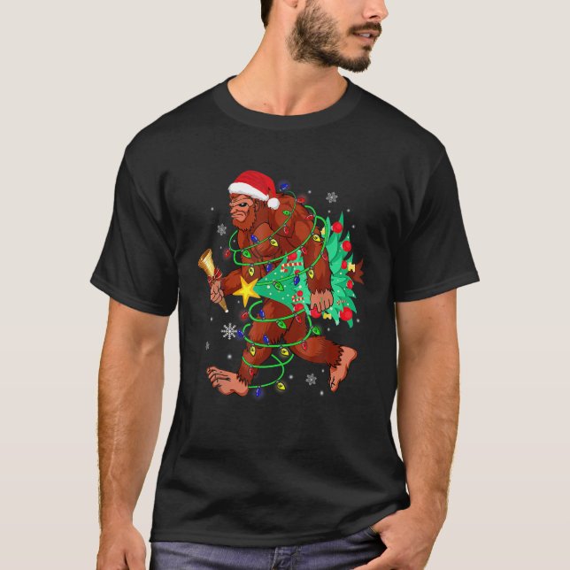 Bigfoot Carrying Christmas Tree Sasquatch Believer T-Shirt (Front)