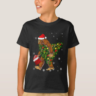Bigfoot Carrying Christmas Tree Sasquatch Believer T-Shirt