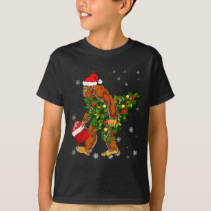 Bigfoot Carrying Christmas Tree Sasquatch Believer T-Shirt
