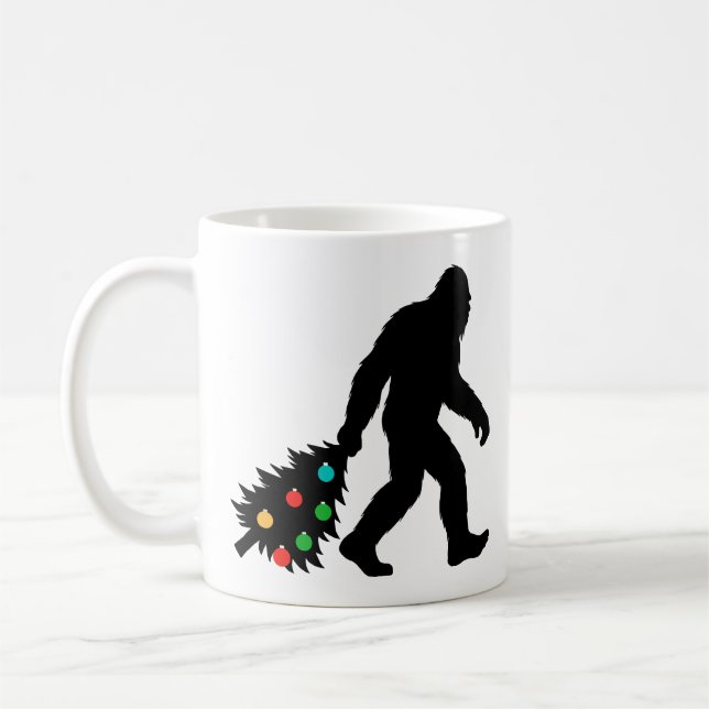 Bigfoot Dragging Christmas Tree  Coffee Mug (Left)