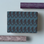 Bigfoot Holding Hands Stripe Wrapping Paper Sheet<br><div class="desc">Elevate your gift-giving game with our Bigfoot Holding Hands Stripe Wrapping Paper Sheets! This quirky and moody gift wrap features the legendary Bigfoot (aka Sasquatch) in a playful design, holding hands against a backdrop of purple, blue, and green stripes. Perfect for adding a touch of humour and charm, this funny...</div>