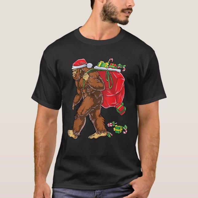 Bigfoot Santa Carrying Christmas Bag Xmas Hat Sasq T-Shirt (Front)