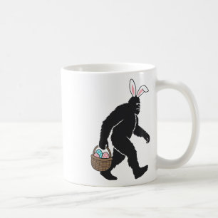 Bigfoot Sasquatch Bunny Ears Carrying Easter Egg B Coffee Mug