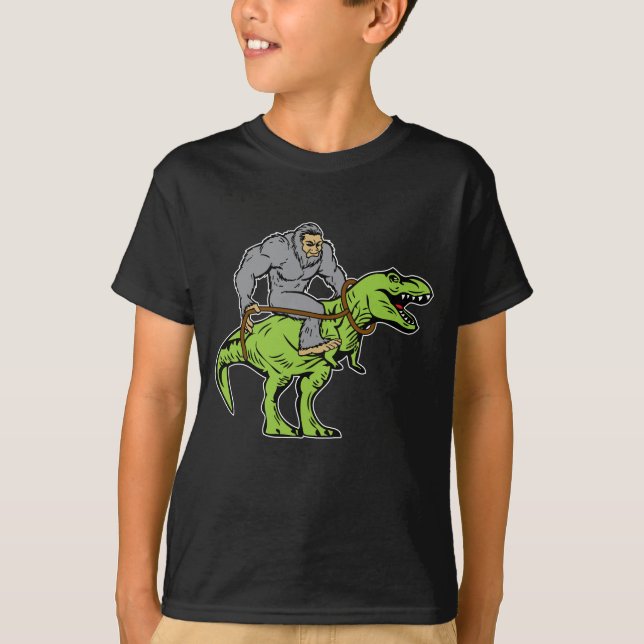 Bigfoot Sasquatch Riding Dinosaur T rex T-Shirt (Front)