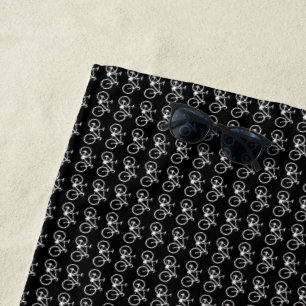 biking pattern of white bicycles on black beach towel