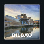 Bilbao Guggenheim Museum Travel Magnet<br><div class="desc">The Guggenheim Museum Bilbao, located in the Basque Country of northern Spain, is one of the most striking contemporary art museums in the world. Designed by renowned architect Frank Gehry, the museum’s futuristic, curvilinear structure is made of titanium, glass, and limestone, creating a breathtaking interplay of light and reflections. Opened...</div>