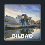 Bilbao Guggenheim Museum Travel Magnet<br><div class="desc">The Guggenheim Museum Bilbao, located in the Basque Country of northern Spain, is one of the most striking contemporary art museums in the world. Designed by renowned architect Frank Gehry, the museum’s futuristic, curvilinear structure is made of titanium, glass, and limestone, creating a breathtaking interplay of light and reflections. Opened...</div>