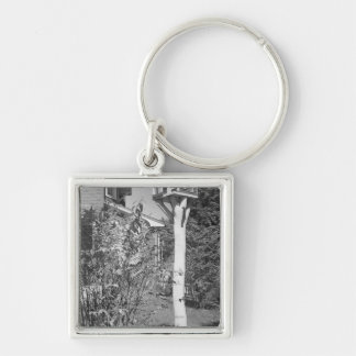 Bird house in garden key ring