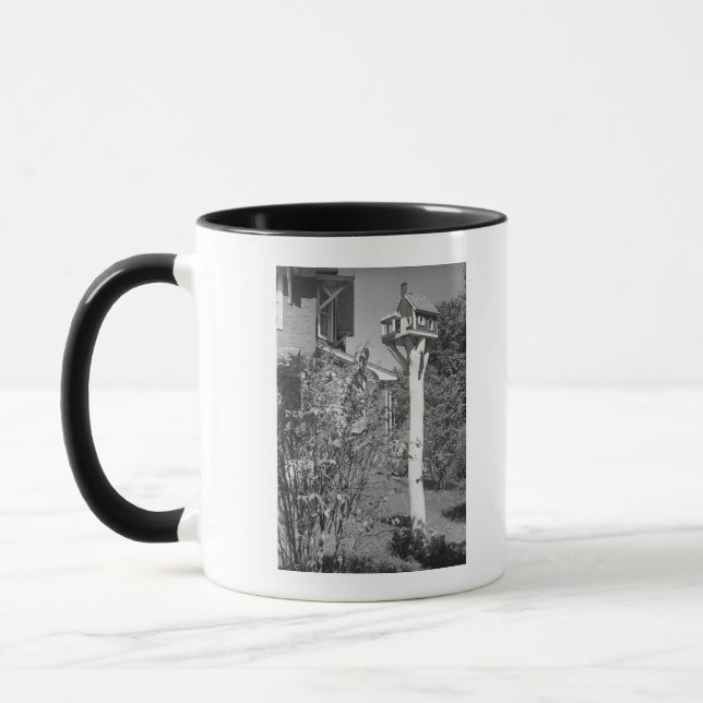 Bird house in garden mug (Left)