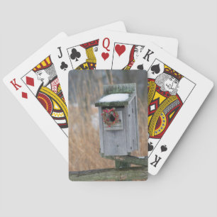 Bird, nest box with holiday wreath in winter playing cards