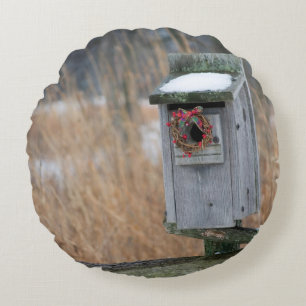 Bird, nest box with holiday wreath in winter round cushion