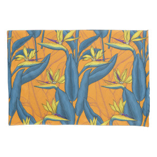Bird of paradise flowers on orange pillowcase