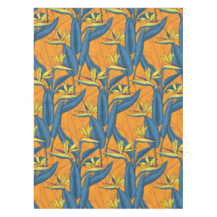Bird of paradise flowers on orange tablecloth