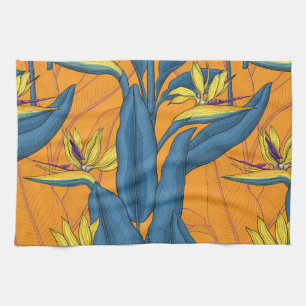 Bird of paradise flowers on orange tea towel