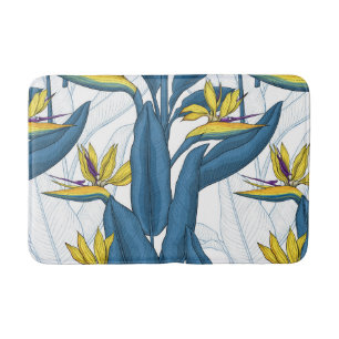 Bird of paradise flowers on white bath mat