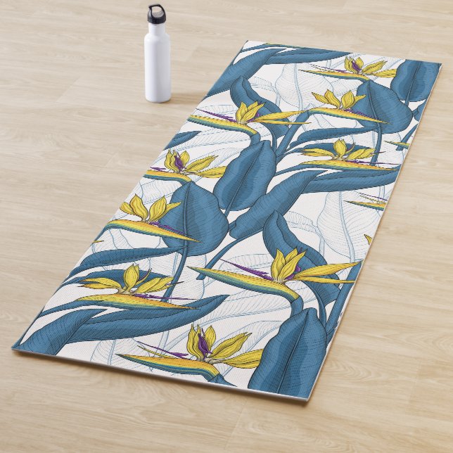 Bird of paradise flowers on white yoga mat (In Situ)