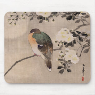 Bird perched on a branch of a blossoming tree mouse mat