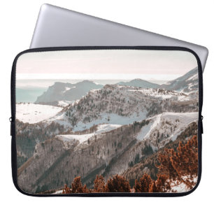 BIRD'S-EYE VIEW OF SNOW COVERED MOUNTAIN UNDER CLE LAPTOP SLEEVE