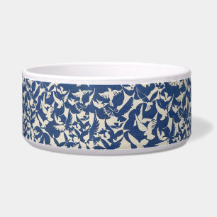 Birds in blue and white pet water bowl