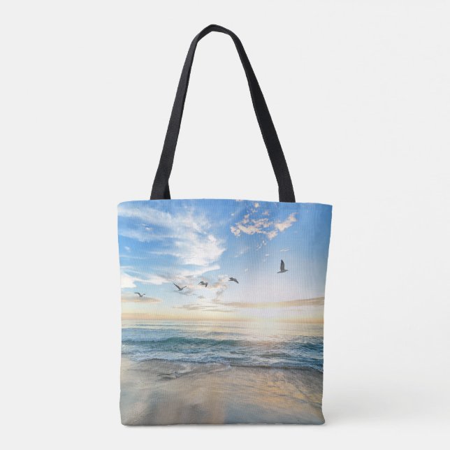 Birds in flight over the ocean tote bag (Back)