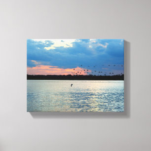 Birds migrating at sunset canvas print