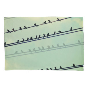 Birds on wires, vintage blue sky. pillowcase
