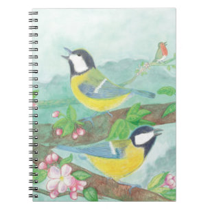 Birds singing on a blossoming tree branch notebook