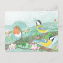 Birds singing on a blossoming tree branch
