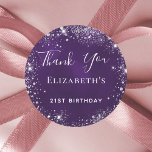 Birthday party purple silver glitter thank you classic round sticker<br><div class="desc">Elegant,  classic,  glamorous for a 21st (or any age) birthday party favors.  A deep purple background,  the purple color is uneven. Decorated with faux silver glitter dust. With the text: Thank You written with a modern hand lettered style script.  Personalize and add a name.</div>