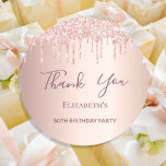 Birthday Party rose gold pink drips Thank You Classic Round Sticker<br><div class="desc">A sticker for a girly and glamorous 50th (or any age) birthday party. A rose gold background with an elegant rose gold and pink drips, paint drip look. The text: Thank You is written in dark rose gold with a large modern hand lettered style script. Tempate for a name and...</div>